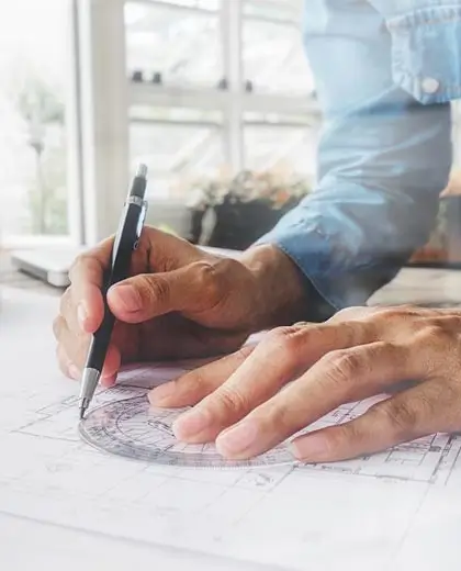 Architect working on a green factory design project